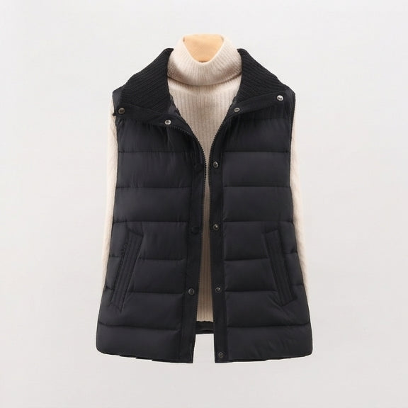 Women's non-padded quilted gilet with high ribbed shawl collar and concealed snap button placket
