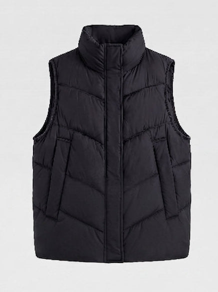 Women's non-padded quilted vest with high stand-up collar, adjustable drawstring hem, and generous flap pockets