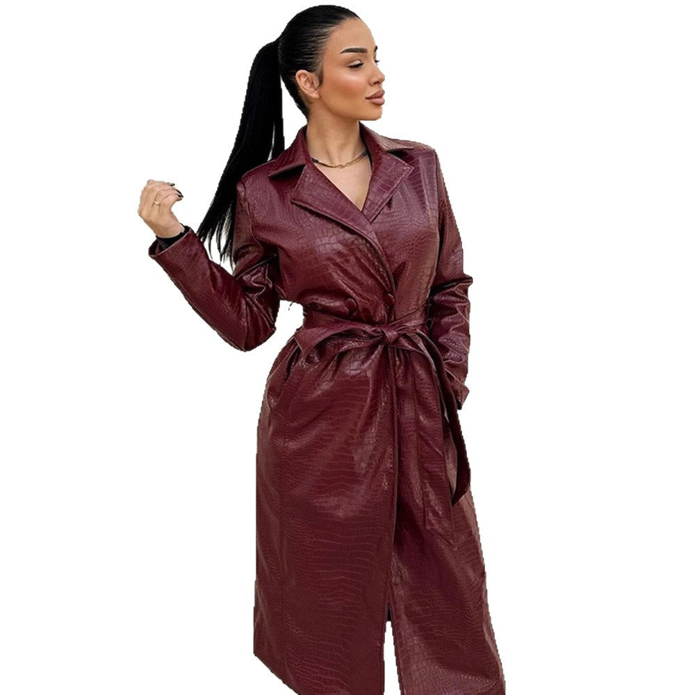Women's long coat made of faux leather with crocodile embossing and waist belt EVA-US