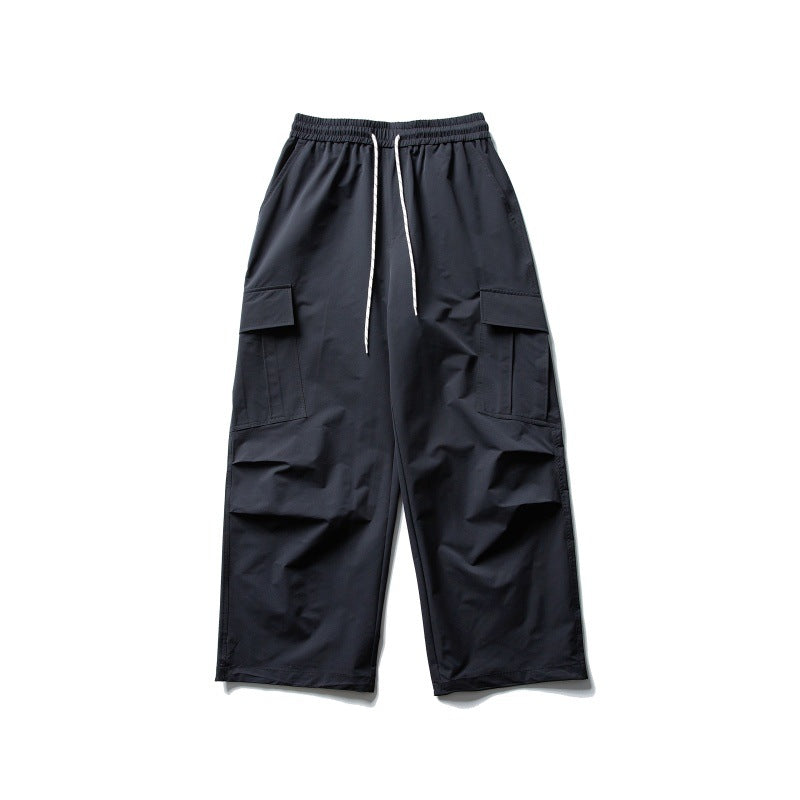 Unisex Wide Cargo Utility Pants in Baggy Cut with Elastic Drawstring and Generous Flap Pockets