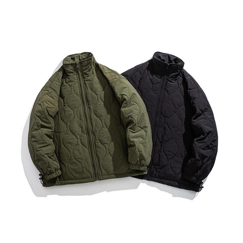 Unisex Boxy quilted jacket in military liner style with high stand-up collar and adjustable hem EVA-US
