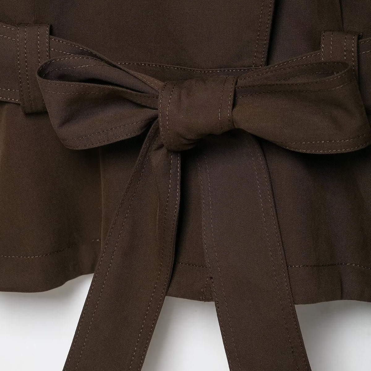 Women's short trench coat with high stand-up collar, tie belt, and asymmetrical button placket EVA-US