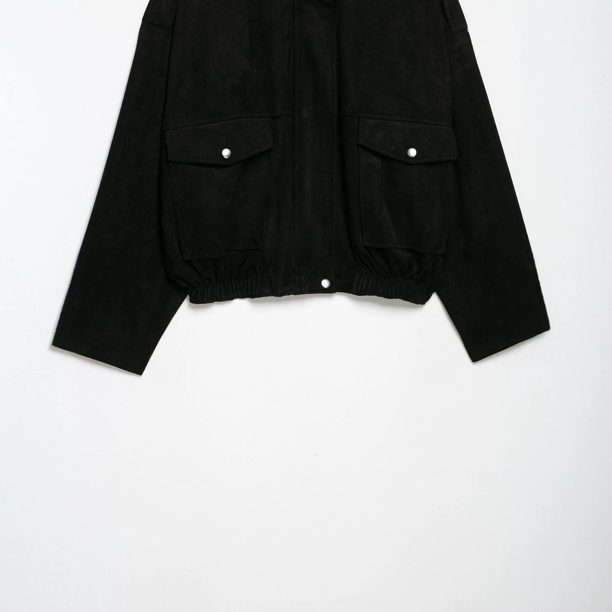 Women's tailored velvet bomber jacket with stand-up collar, shoulder epaulettes, and large flap pockets