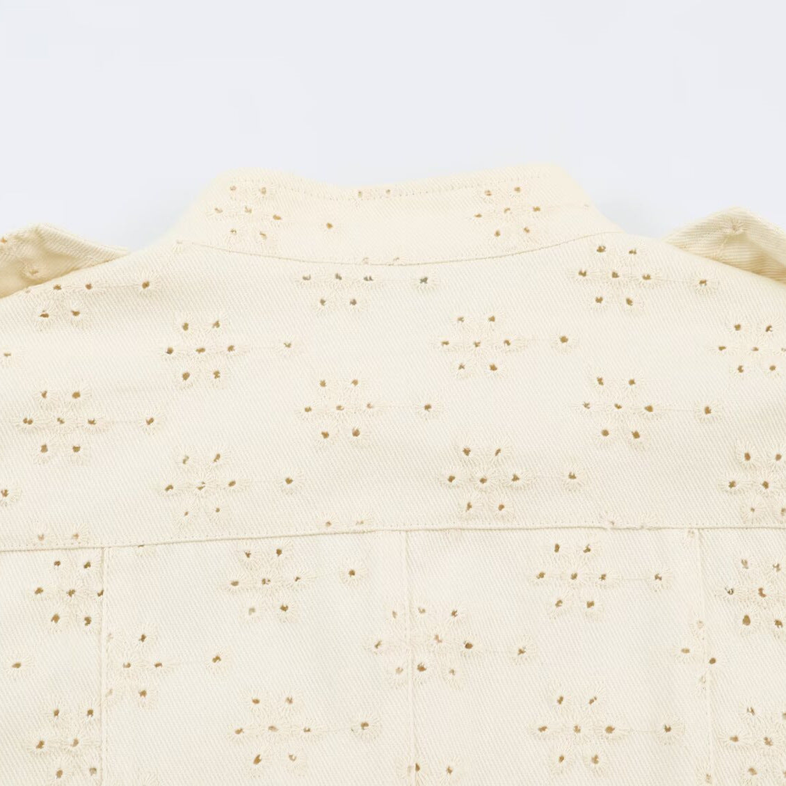 Ladies short jacket made of broderie anglaise with stand-up collar and patch pockets EVA-US