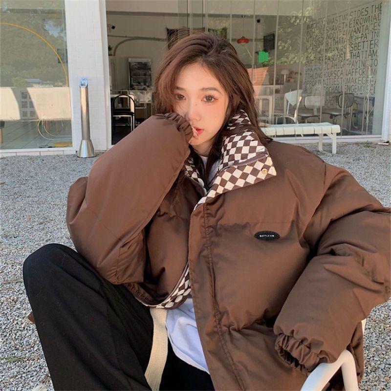 Short, padded women's jacket in oversized style