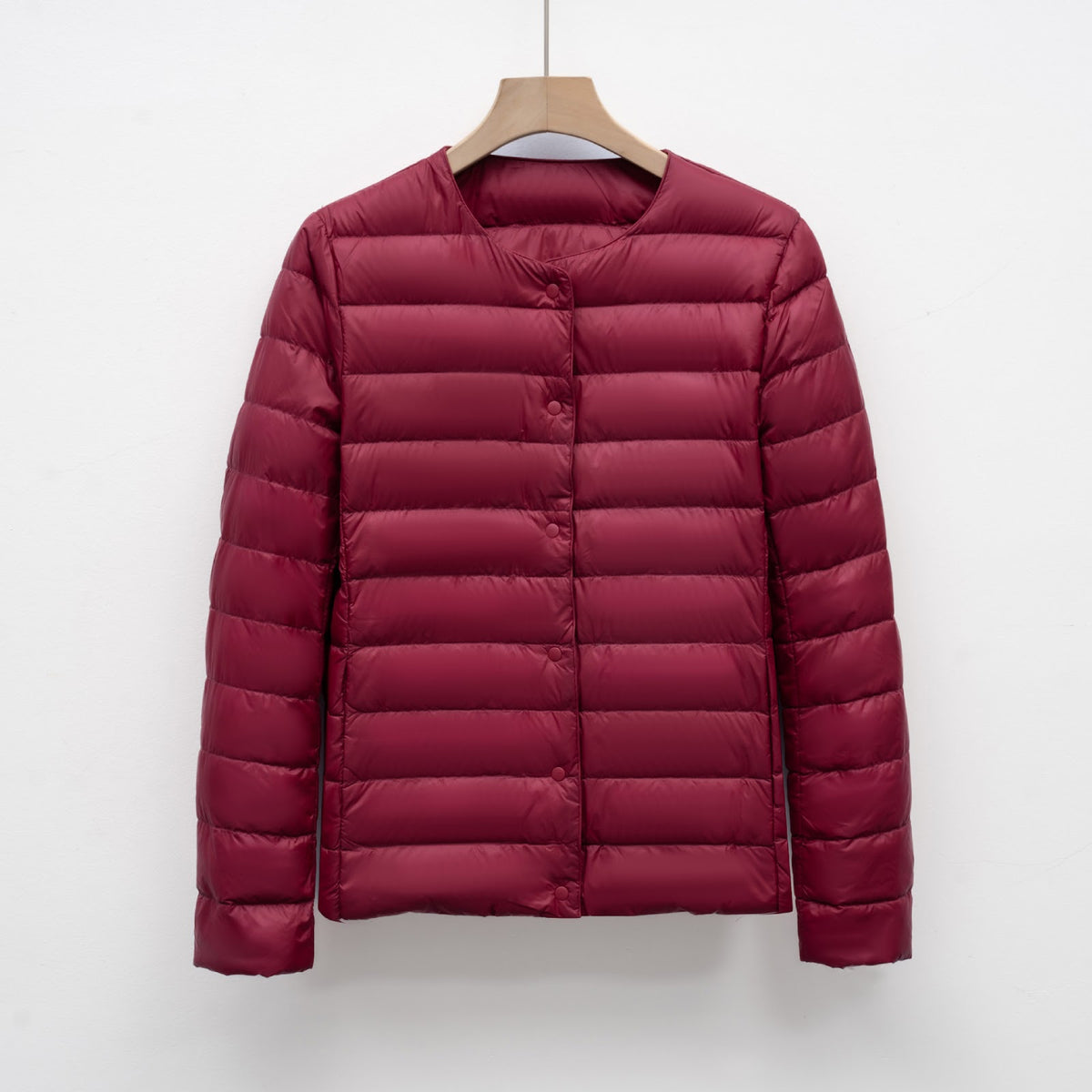 Light women's quilted jacket with round neckline