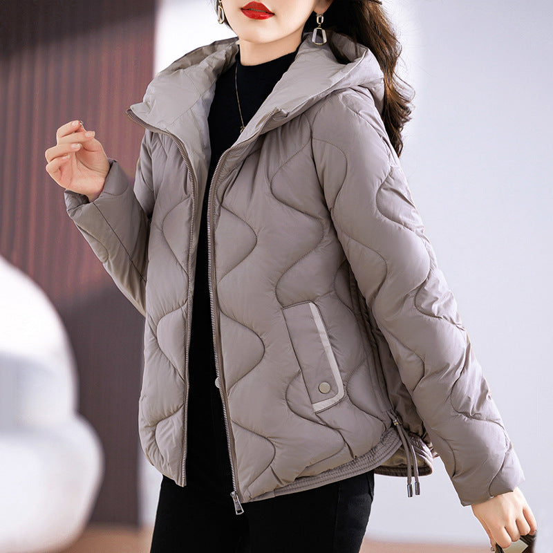 Short women's quilted jacket, shiny, with hood