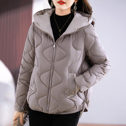 Short women's quilted jacket, shiny, with hood