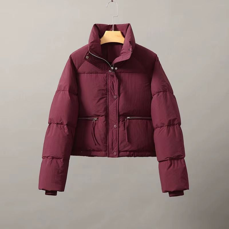 Short women's quilted jacket with stand-up collar