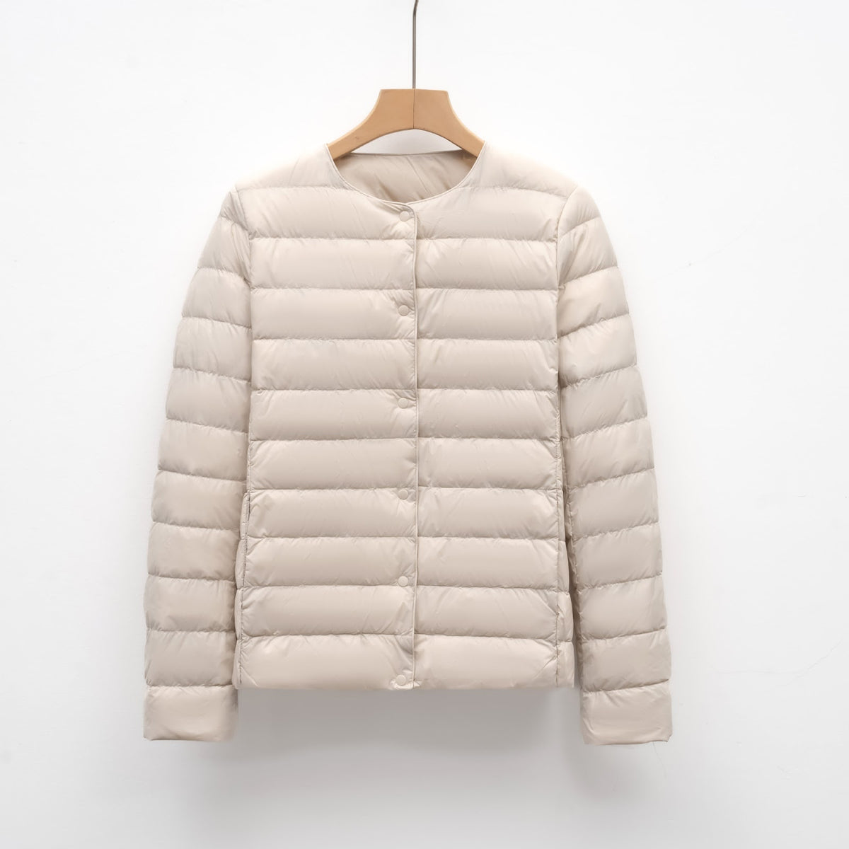 Light women's quilted jacket with round neckline