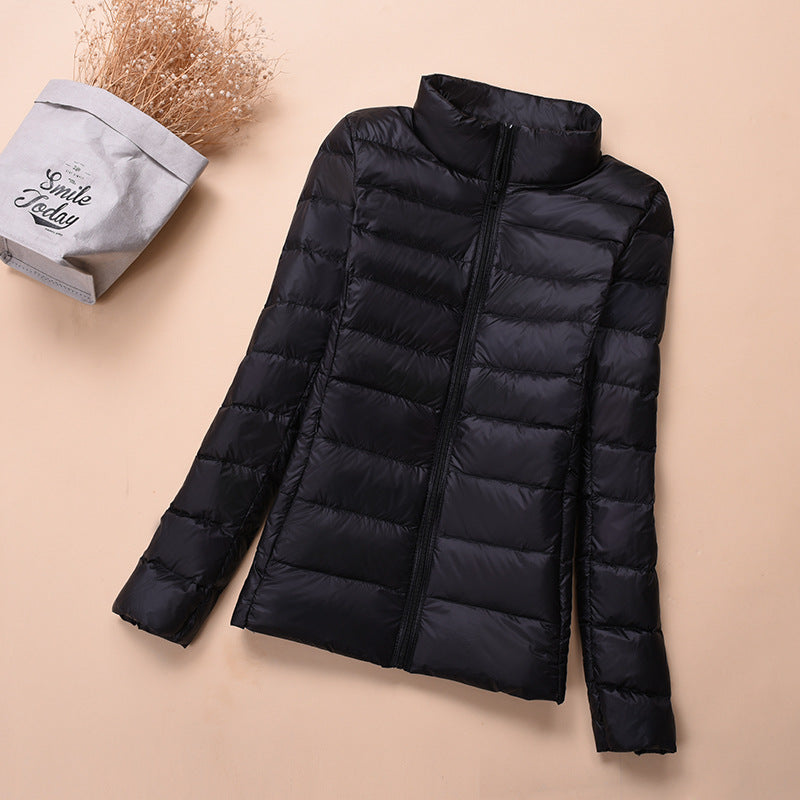 Light women's down jacket, short, with white duck down