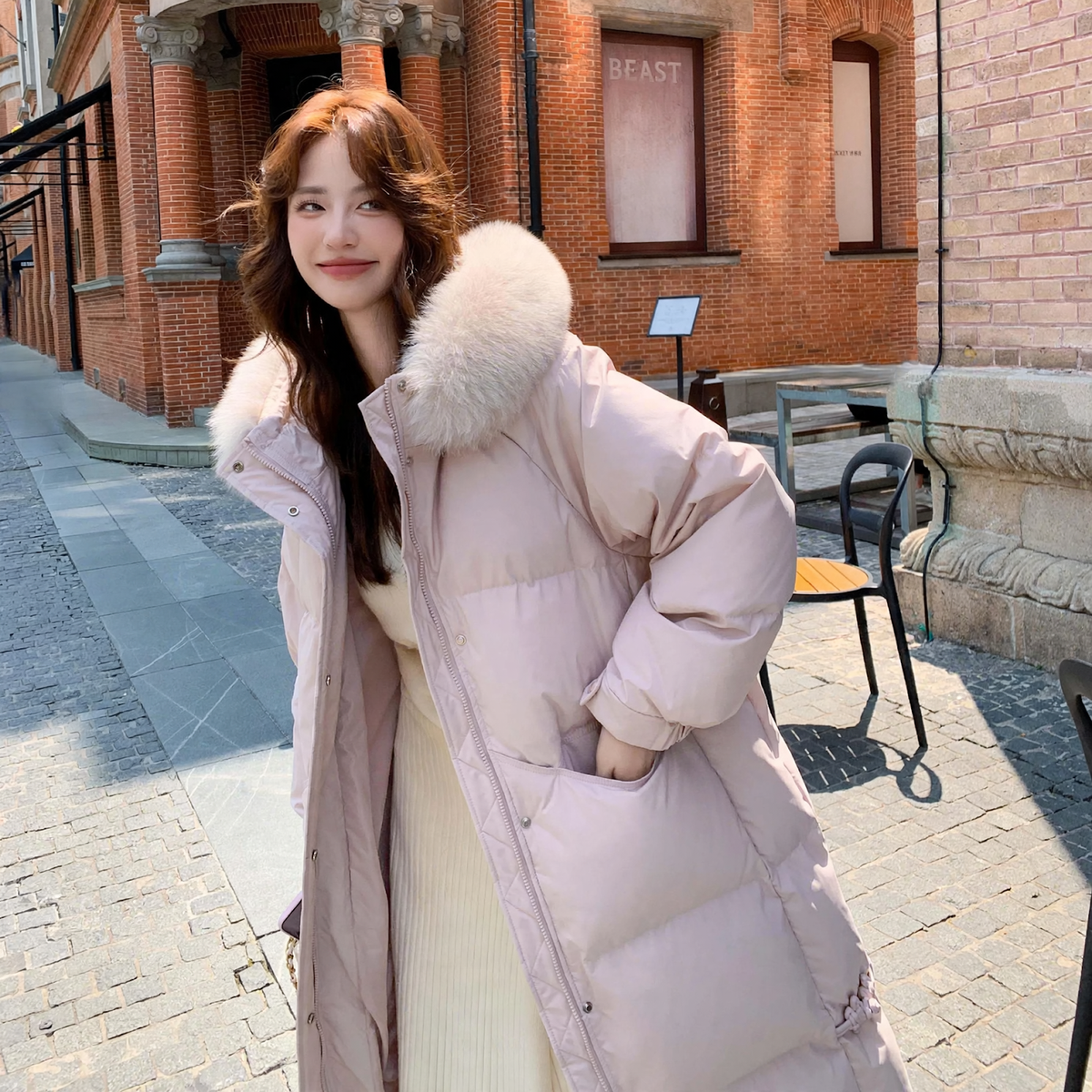 Long women's down jacket in plus size with fur collar
