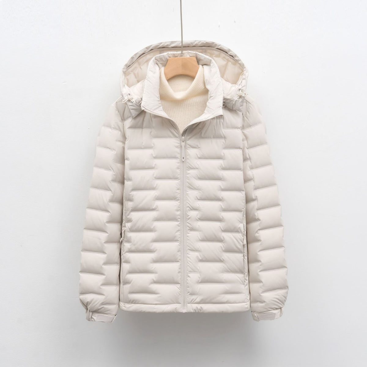Light women's down jacket with hood, short