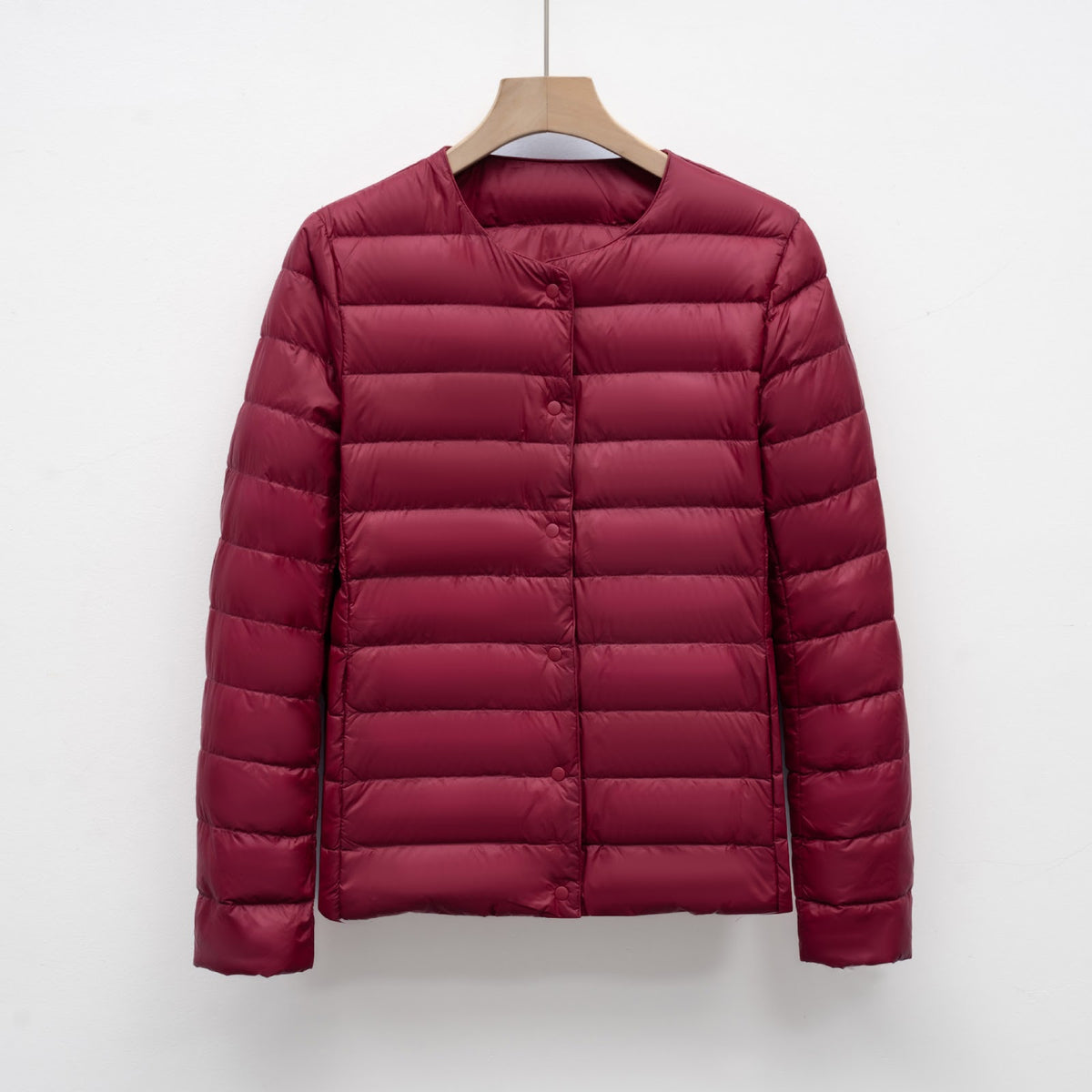 Light women's quilted jacket with round neckline