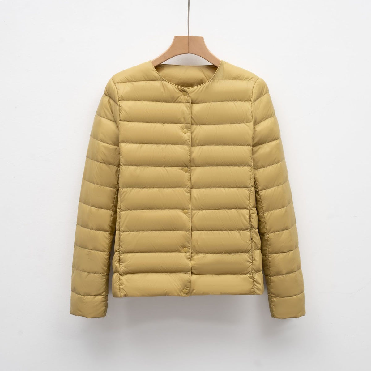 Light women's quilted jacket with round neckline