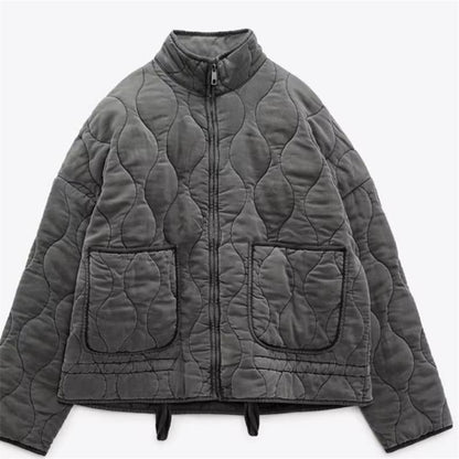 Women's quilted jacket with standing collar and tie belt