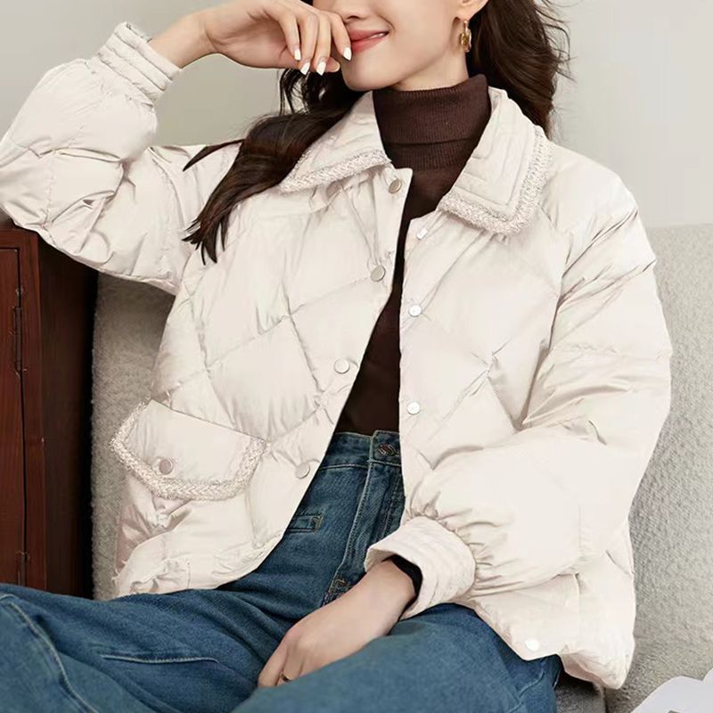 Short women's quilted jacket in diamond design