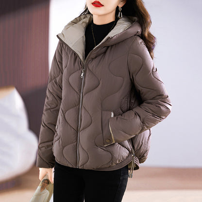 Short women's quilted jacket, shiny, with hood