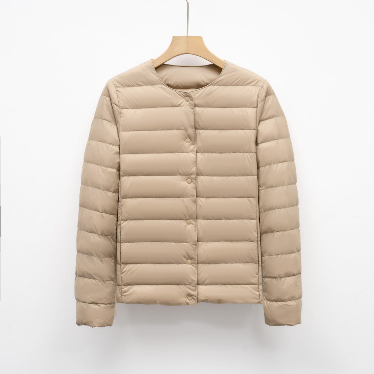 Light women's quilted jacket with round neckline