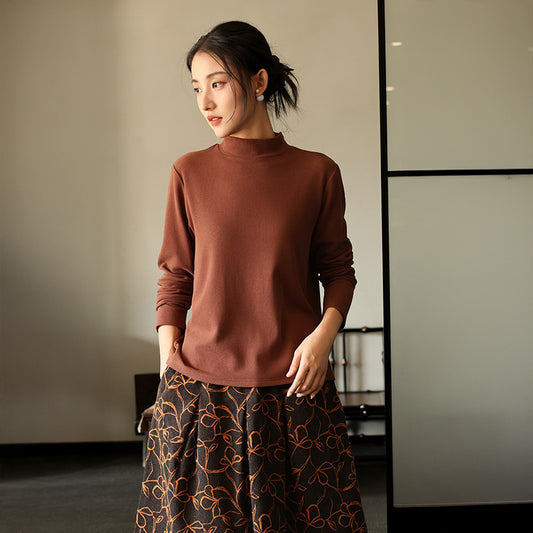 Warm knitted pullover with stand-up collar