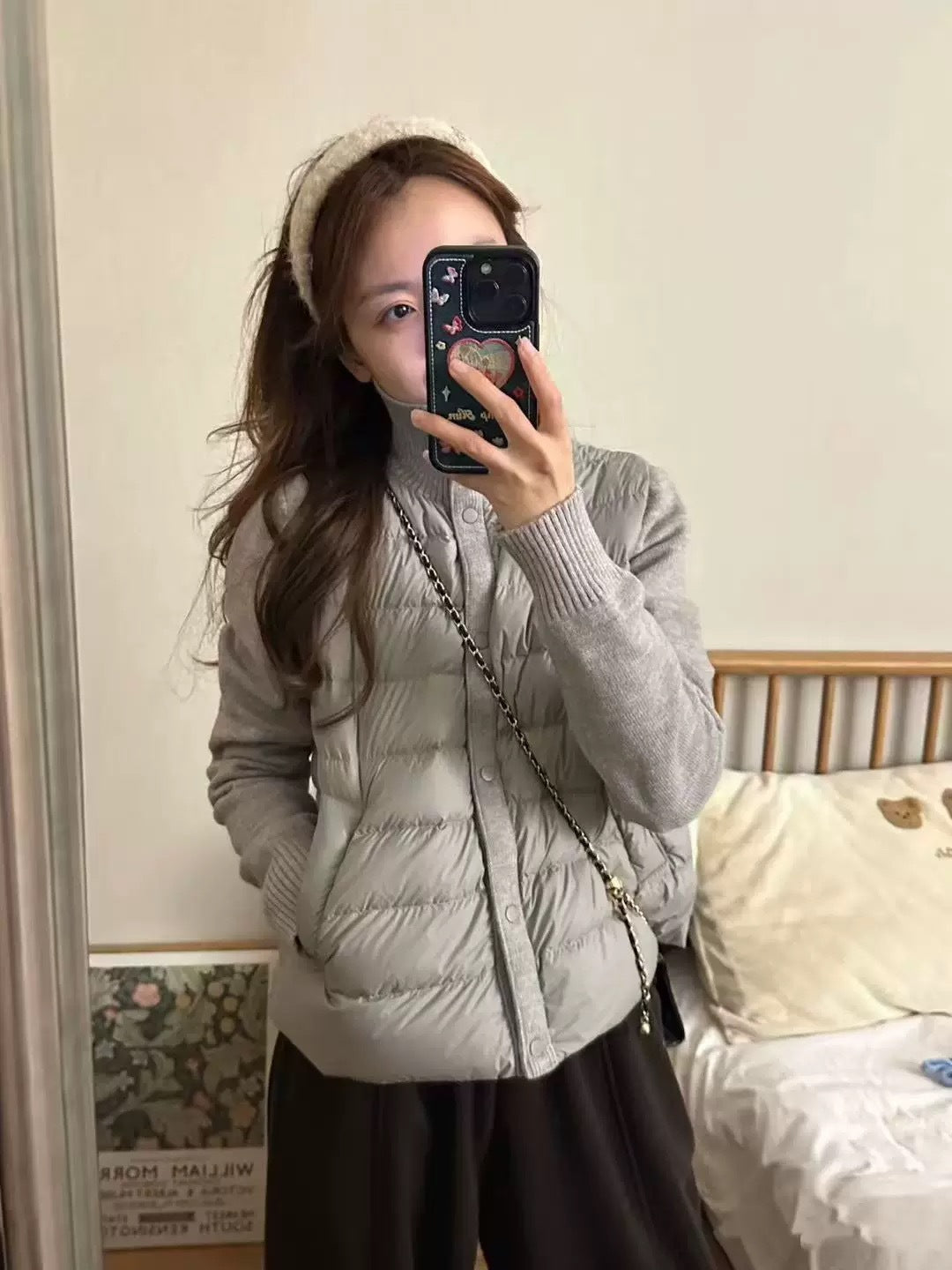 Short women's down jacket with knitted sleeves