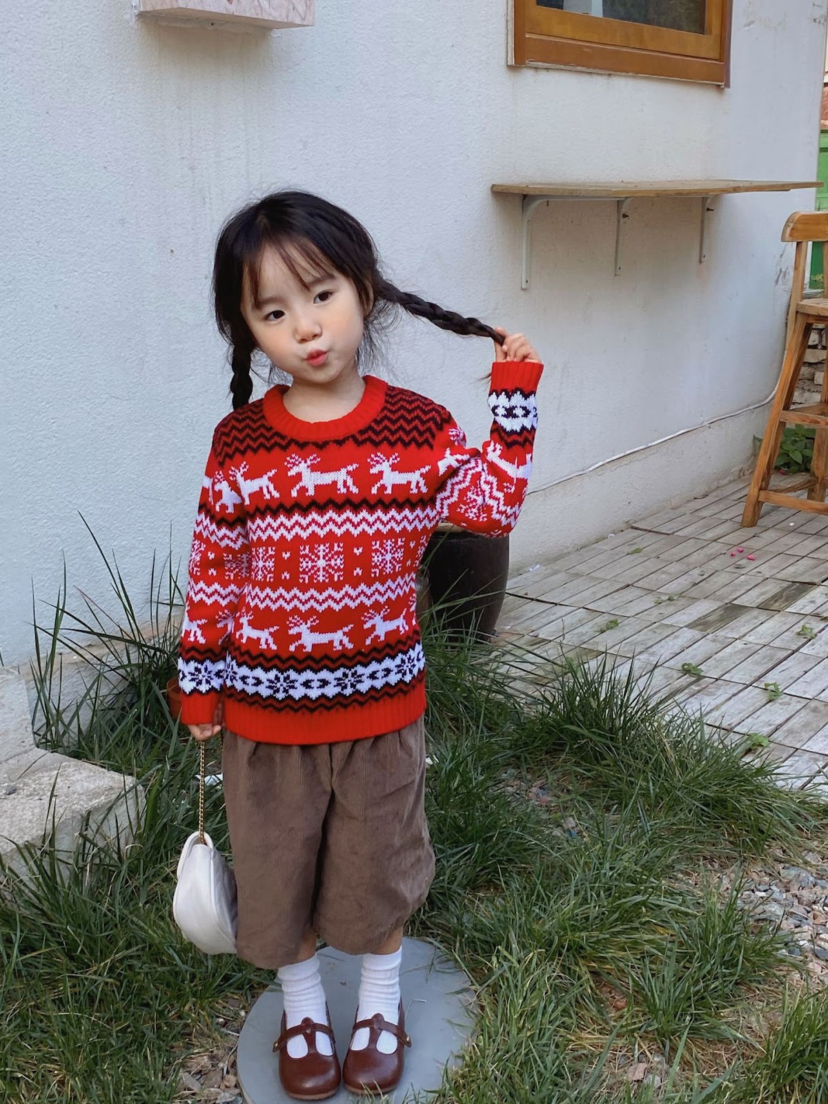Christmas sweater with snowflake and reindeer motif
