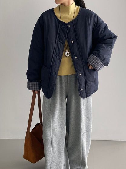 Loose women's quilted jacket in check pattern