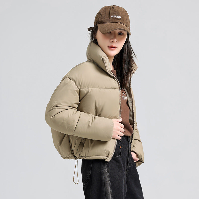 Short women's quilted jacket with stand-up collar, lined