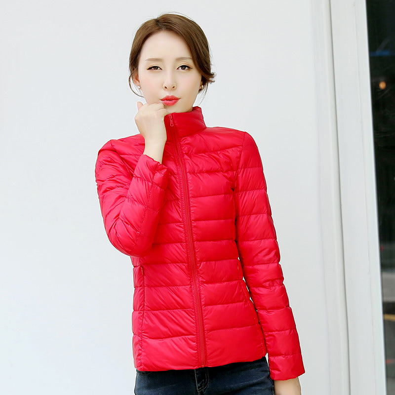Light women's down jacket with stand-up collar, white duck down
