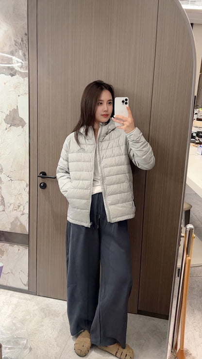 Short women's down jacket with hood