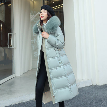 Longer, padded women's coat with faux fur collar
