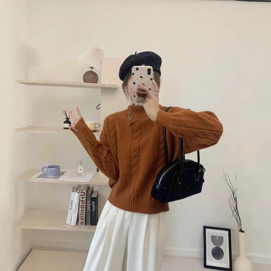 Short cable knit sweater with asymmetric neckline