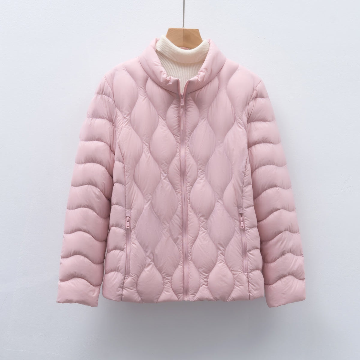 Light women's down jacket with stand-up collar and wave pattern