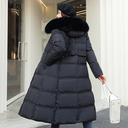 Longer, padded women's coat with faux fur collar