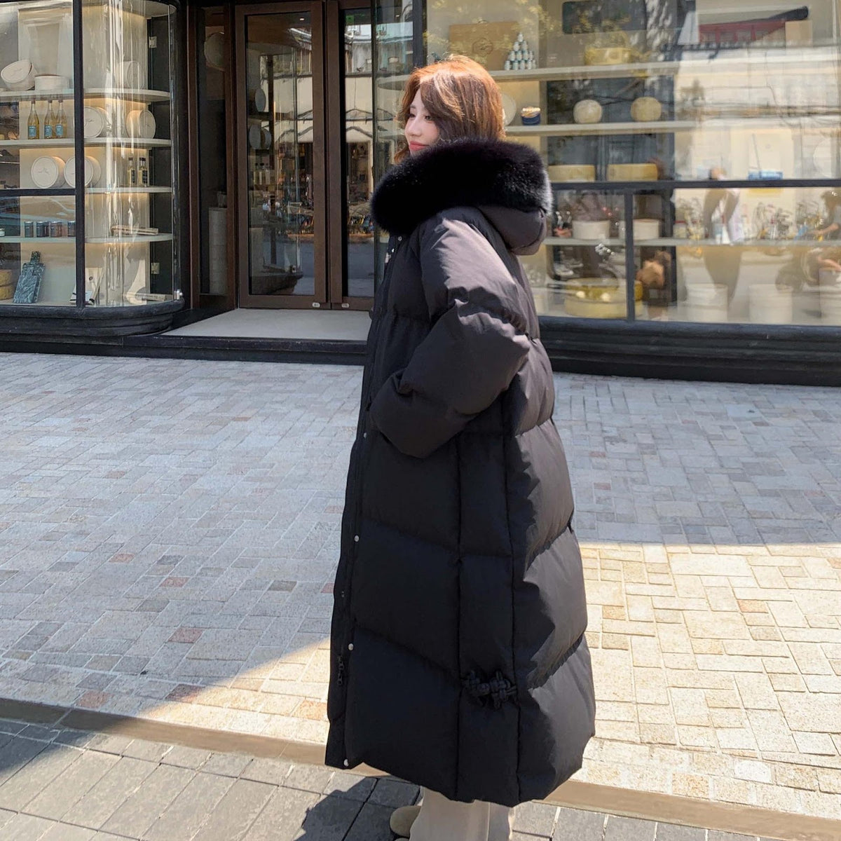 Long women's down jacket in plus size with fur collar