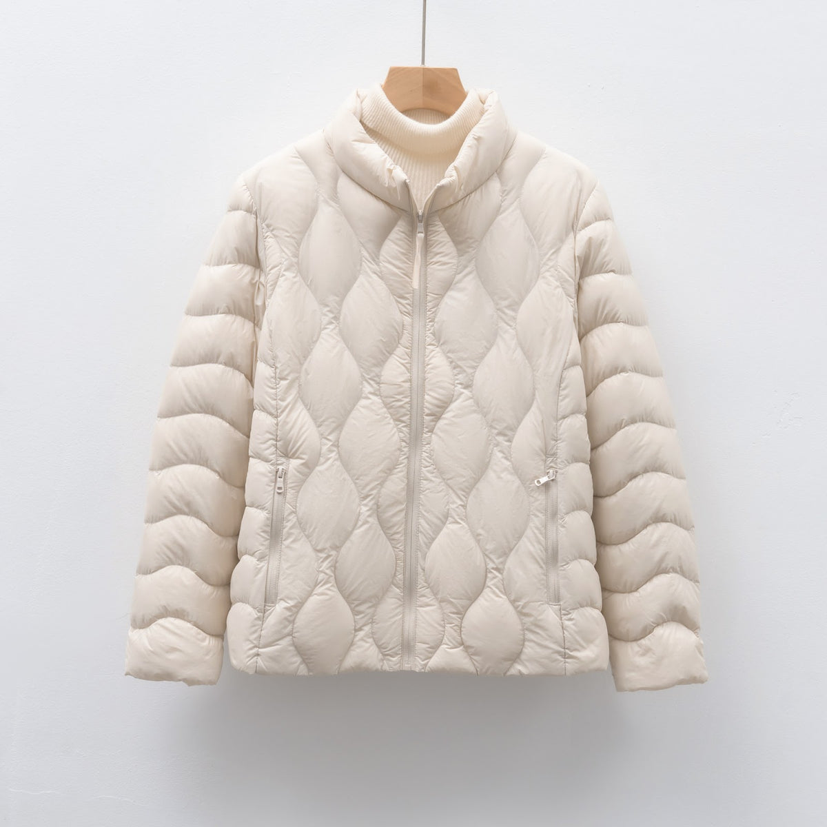 Light women's down jacket with stand-up collar and wave pattern