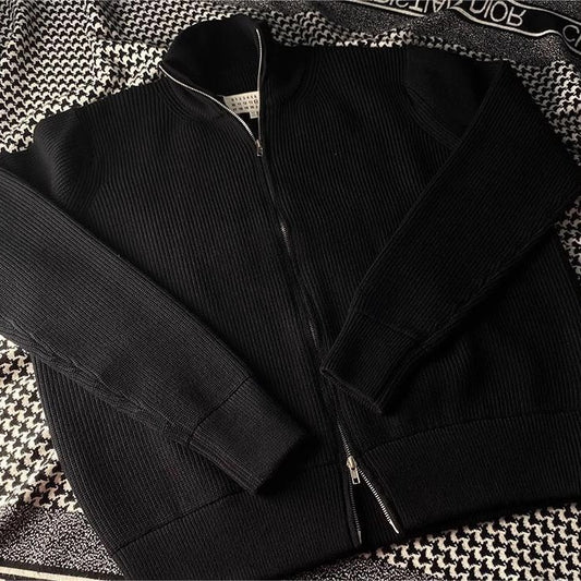 Loose women's knit sweater with zipper and stand-up collar