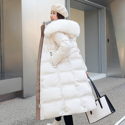 Longer, padded women's coat with faux fur collar