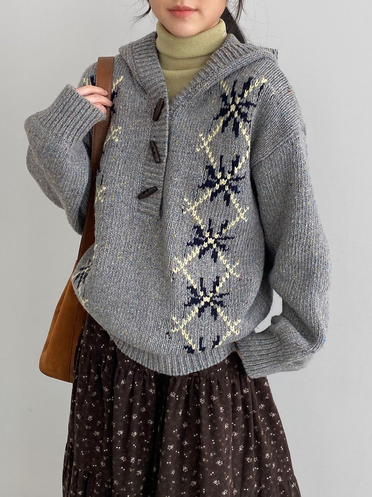 Hooded pullover with snowflake pattern, knitted