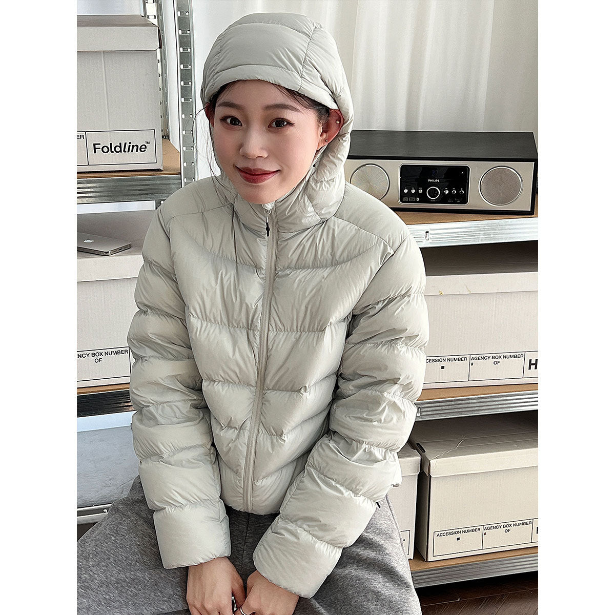 Light women's down jacket with hood, white duck down
