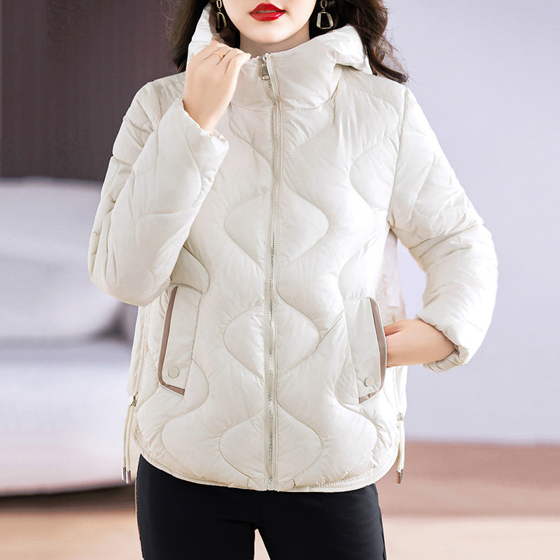 Short women's quilted jacket, shiny, with hood