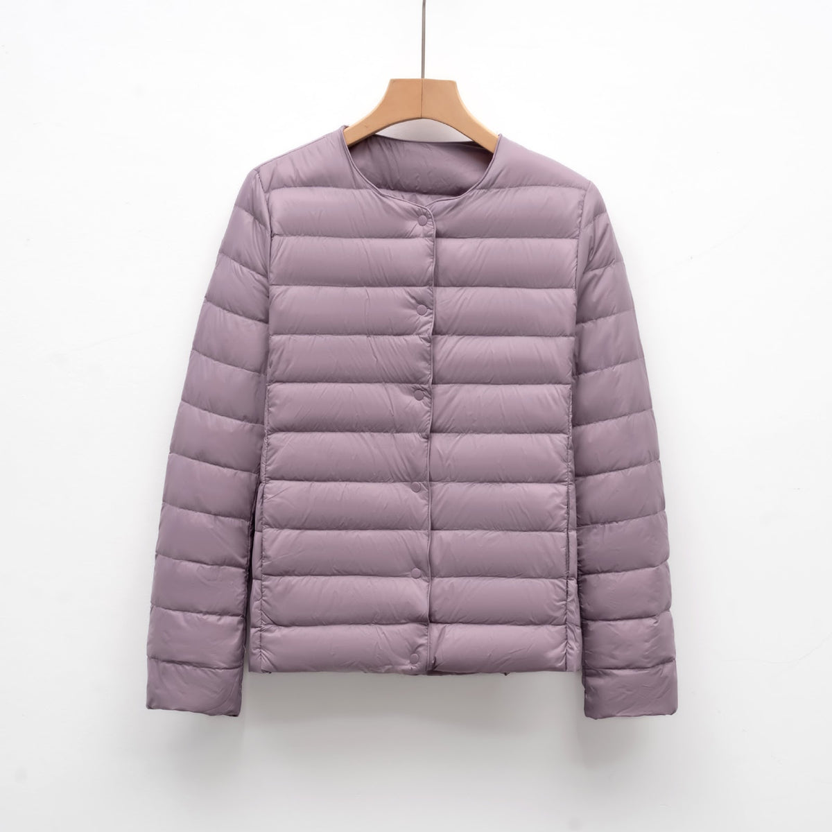 Light women's quilted jacket with round neckline