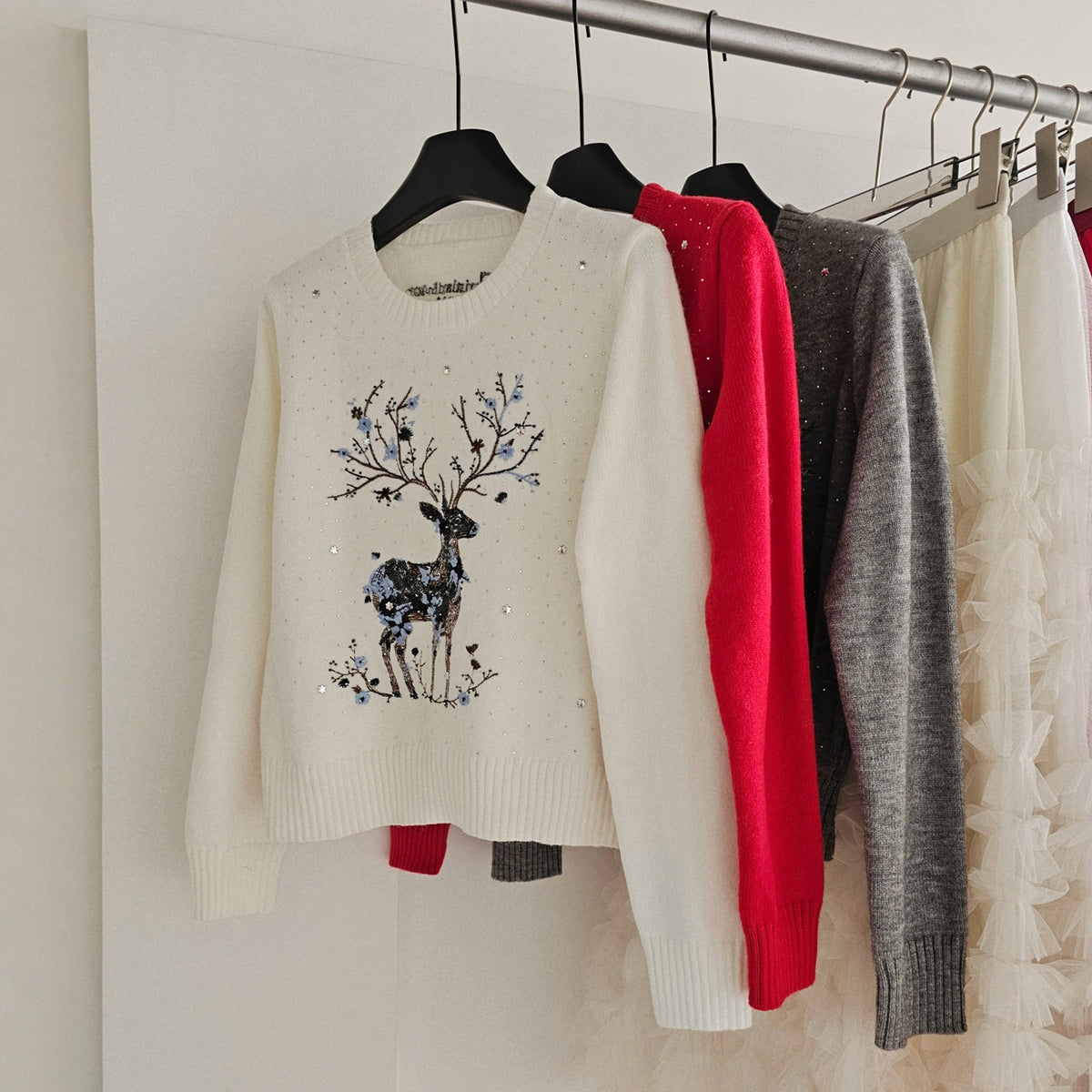 Knitted sweater with reindeer embroidery and sequins