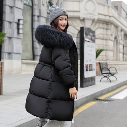 Padded women's winter jacket, mid-length, with fur collar