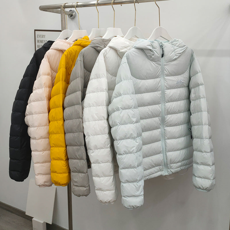 Light women's down jacket with hood, quilted