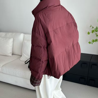 Short women's down jacket with high filling volume