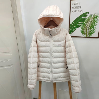 Light women's down jacket with hood, quilted
