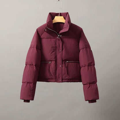 Short women's quilted jacket with stand-up collar