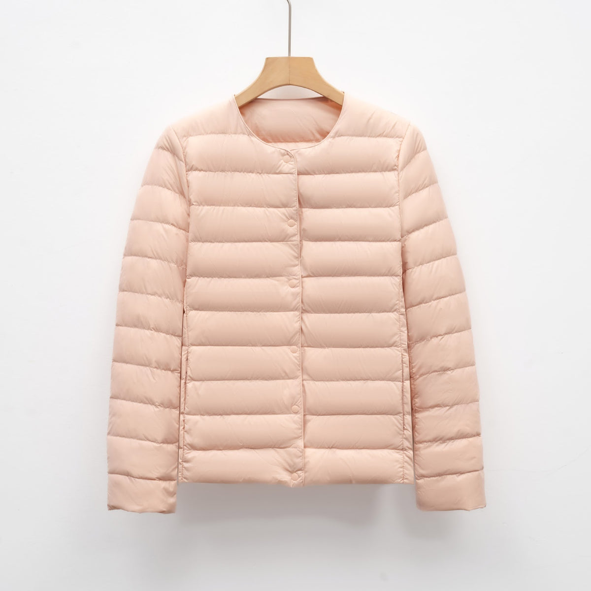 Light women's quilted jacket with round neckline