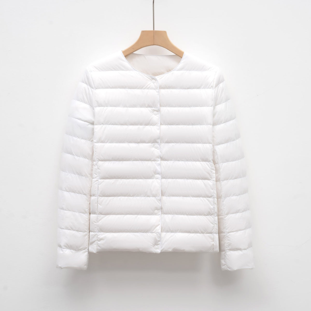 Light women's quilted jacket with round neckline